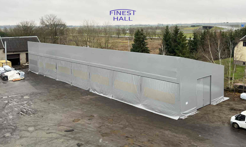 Finest-Hall Factory OÜ toodetud ja paigaldatud varikatus mõõtudega 12x45,5m + 7m, kõrgusega 8 meetrit EK Wood OÜ-le.